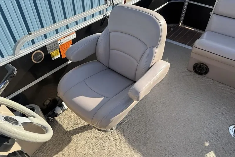 Slide: The Image of Steering console of a 2013 South Bay 422 CR pontoon boat with gauges and controls. - 20