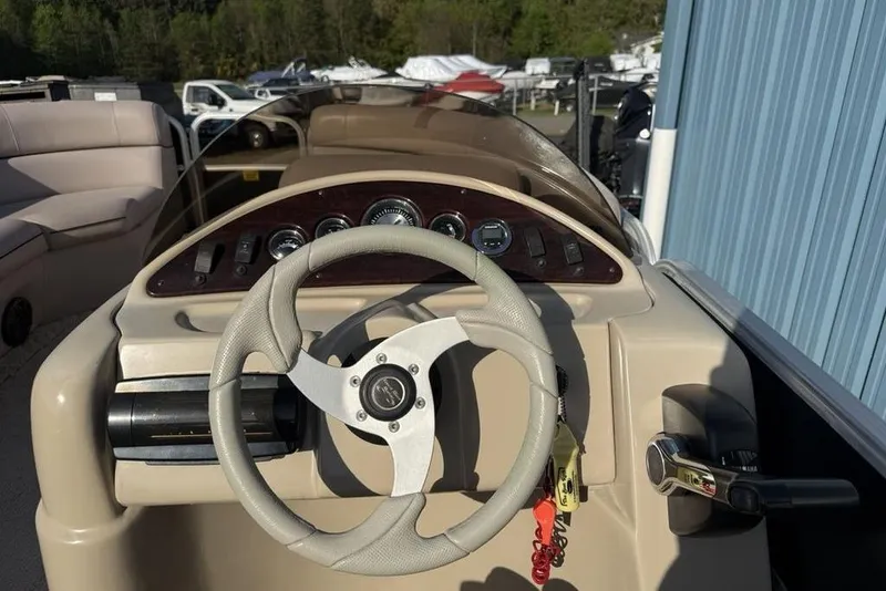 Slide: The Image of Open storage compartment in a 2013 South Bay 422 CR boat seat. - 21