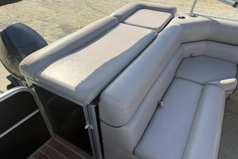 Slide: The Image of 2013 South Bay 422 CR boat seating with visible wear and tear on upholstery. - 29