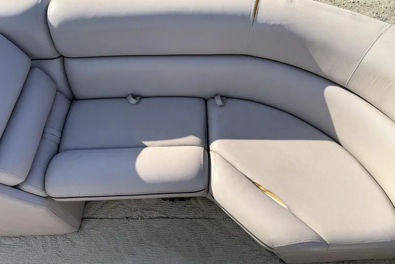 Slide: The Image of 2013 South Bay 422 CR boat seating with integrated storage compartment. - 30