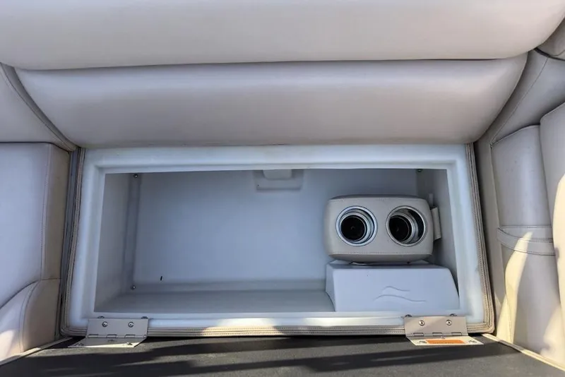 Slide: The Image of 2013 South Bay 422 CR boat seating with light gray upholstery and visible wear. - 32