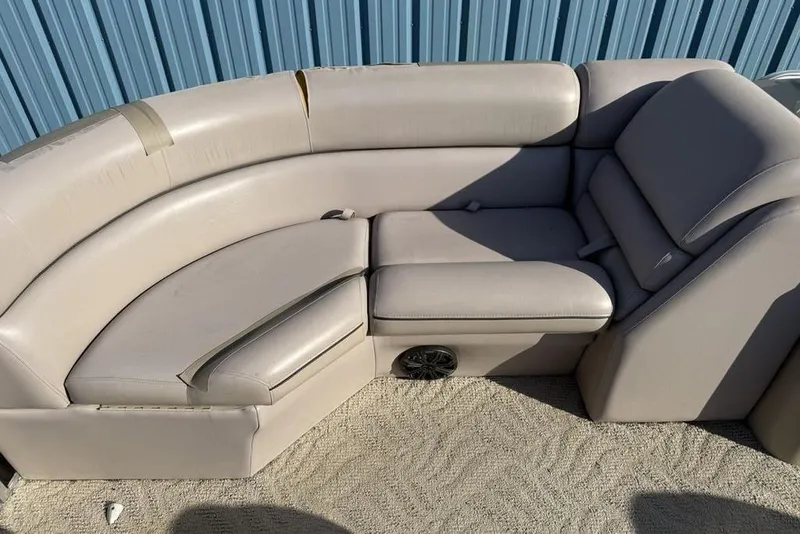 Slide: The Image of 2013 South Bay 422 CR boat interior with open storage compartment and beige seating. - 34