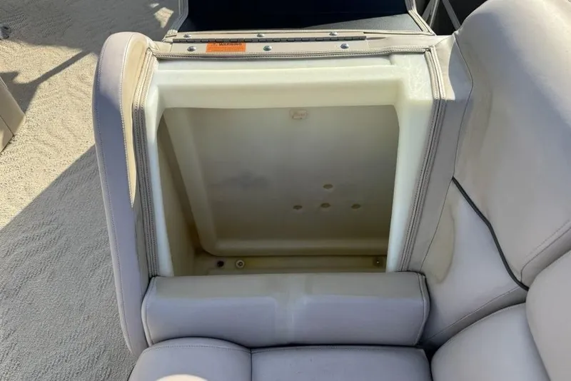 Slide: The Image of 2013 South Bay 422 CR pontoon boat interior with beige seating and carpet. - 6