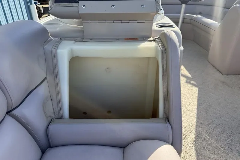 Slide: The Image of 2013 South Bay 422 CR boat seating with light gray upholstery and visible wear. - 8