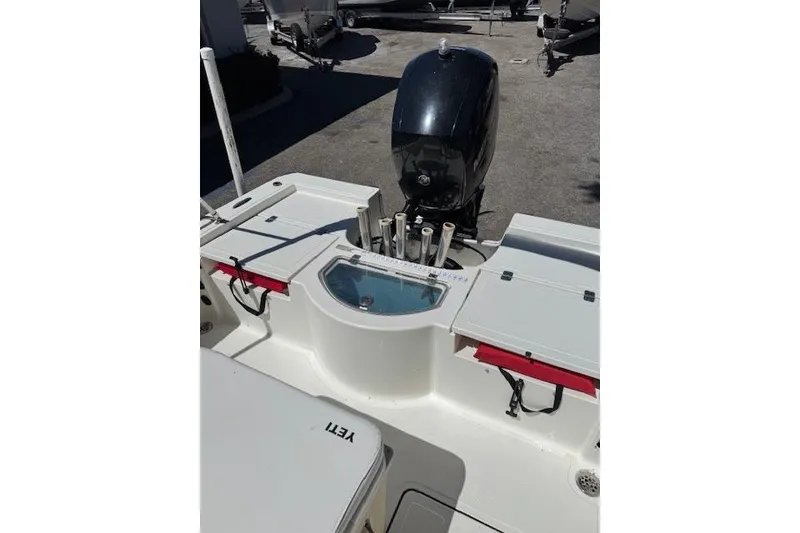 Slide: The Image of 2013 Tideline 190 boat with outboard motor and fishing rod holders. - 11
