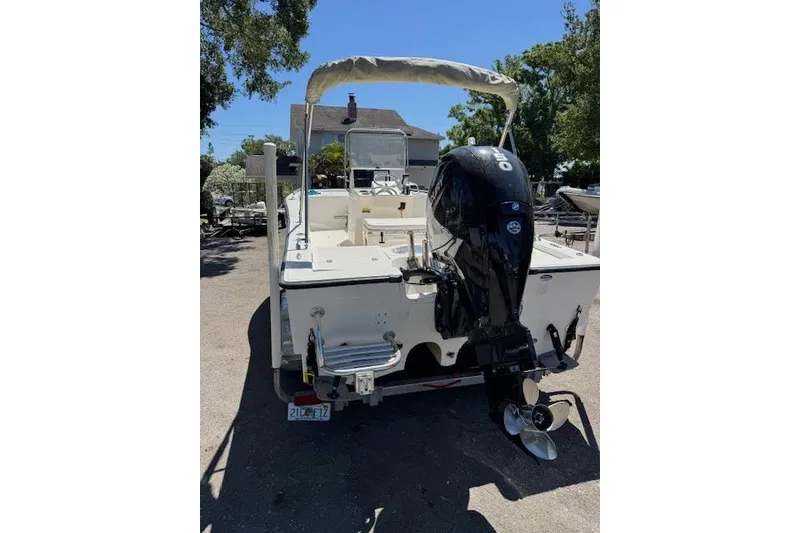 Slide: The Image of 2013 Tideline 190 boat with outboard motor, parked outdoors. - 6