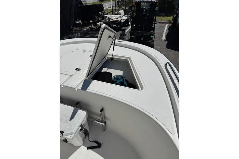 Slide: The Image of 2013 Tideline 190 boat with open storage compartment on deck. - 8