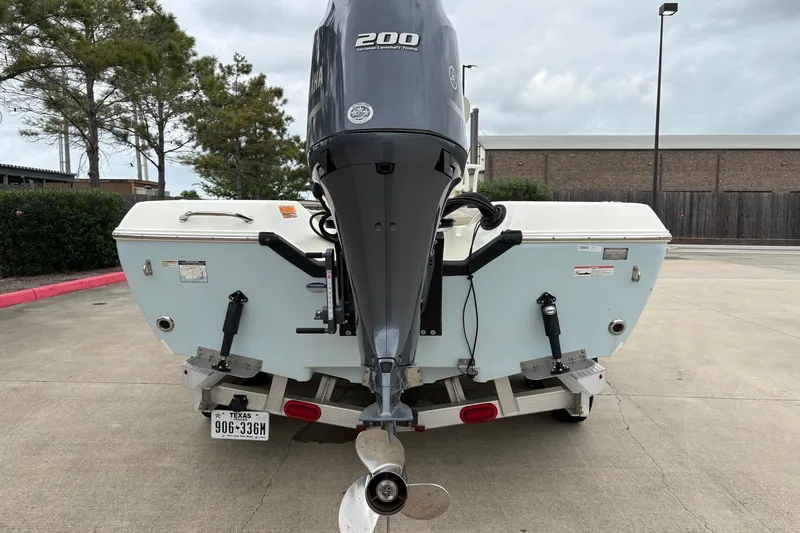 Slide: The Image of 2015 Skeeter SX2250 boat with Yamaha 200 engine, parked on a trailer. - 5