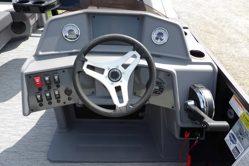 Slide: The Image of 2026 Sylvan R-20 PARTY FISH boat dashboard with steering wheel and control panel. - 15