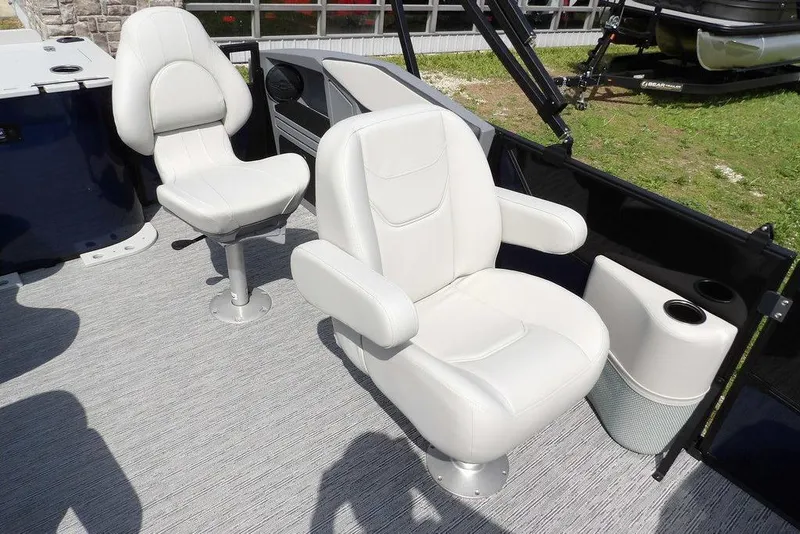 Slide: The Image of 2026 Sylvan R-20 PARTY FISH boat interior with two white captain chairs. - 16