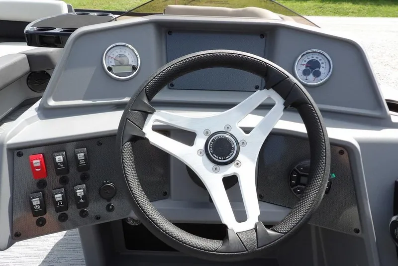 Slide: The Image of Steering console of 2026 Sylvan R-20 PARTY FISH boat with gauges and controls. - 18