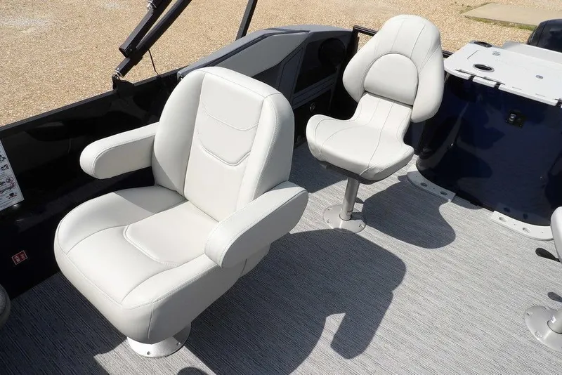 Slide: The Image of 2026 Sylvan R-20 PARTY FISH boat interior with two white cushioned seats. - 20