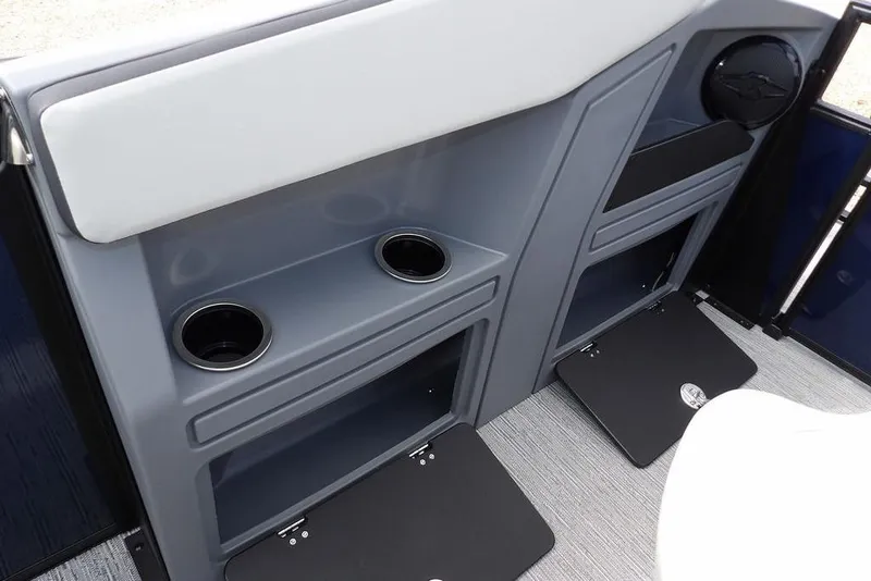 Slide: The Image of Interior of 2026 Sylvan R-20 PARTY FISH boat with cup holders and storage compartments. - 23