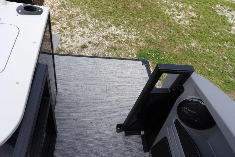 Slide: The Image of 2026 Sylvan R-20 PARTY FISH boat deck with open gate and speaker. - 28