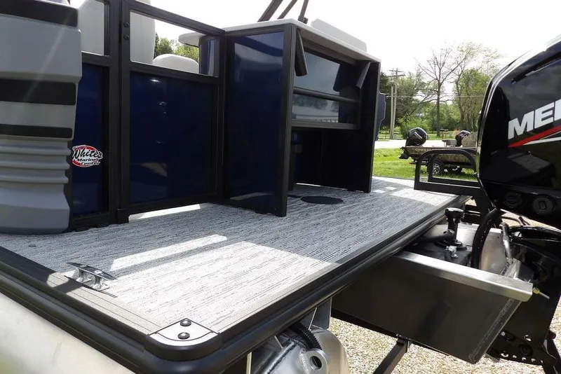 Slide: The Image of 2026 Sylvan R-20 PARTY FISH boat deck with Mercury engine, showcasing modern design. - 32