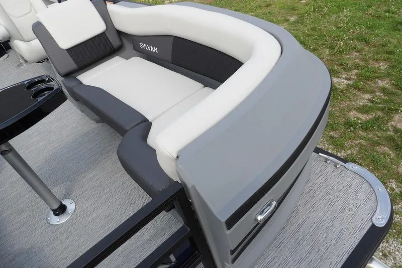 Slide: The Image of 2026 Sylvan R-20 PARTY FISH pontoon boat interior with plush seating and cup holders. - 7