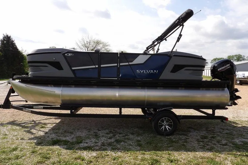 Slide: The Image of 2026 Sylvan R-20 PARTY FISH pontoon boat on trailer, featuring sleek design and Mercury outboard motor. - 9