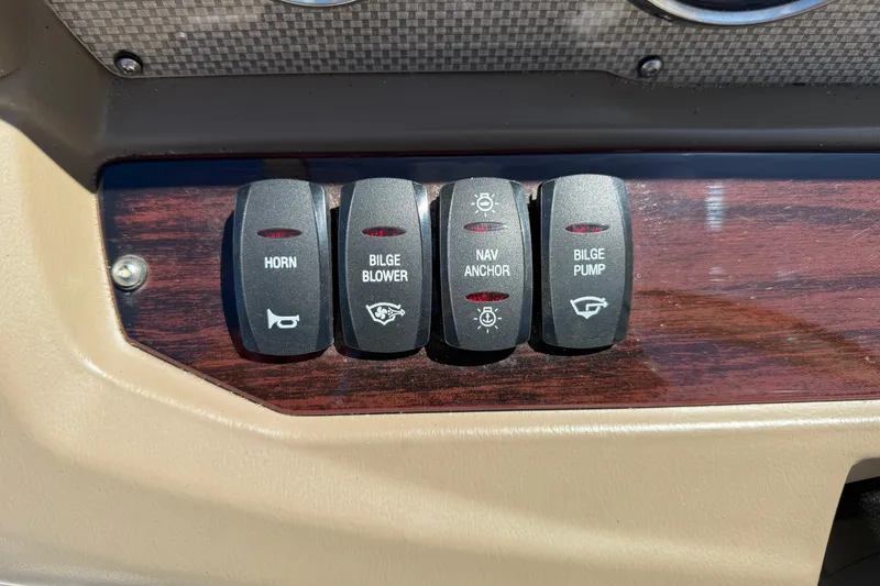 Slide: The Image of Control panel of a 2013 Regal 1900 Bowrider boat with labeled switches. - 10