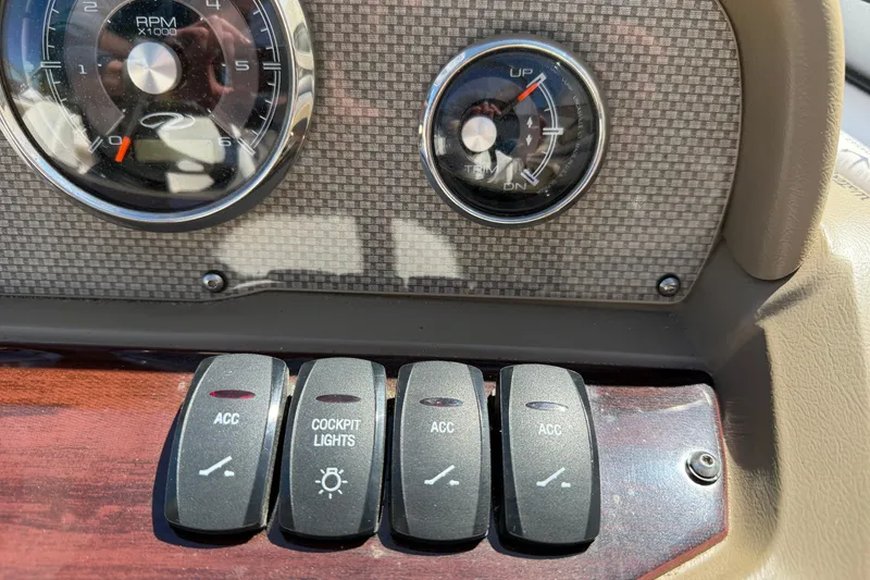 Slide: The Image of Dashboard of a 2013 Regal 1900 Bowrider with gauges and control switches. - 13