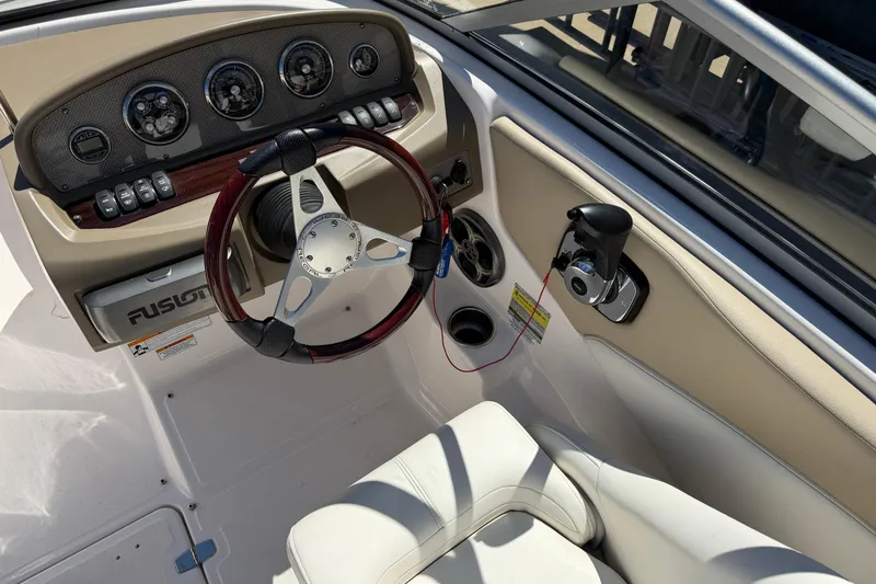 Slide: The Image of 2013 Regal 1900 Bowrider dashboard with steering wheel and controls. - 14