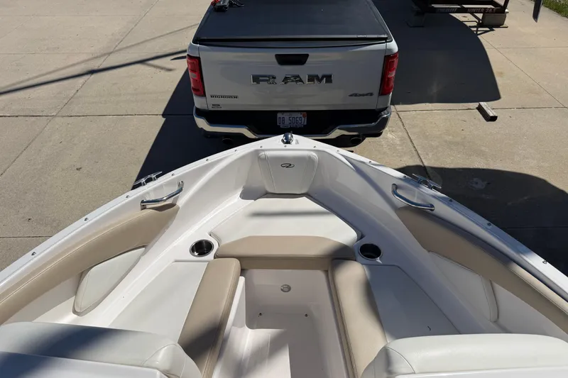 Slide: The Image of 2013 Regal 1900 Bowrider boat hitched to a RAM truck in a driveway. - 18