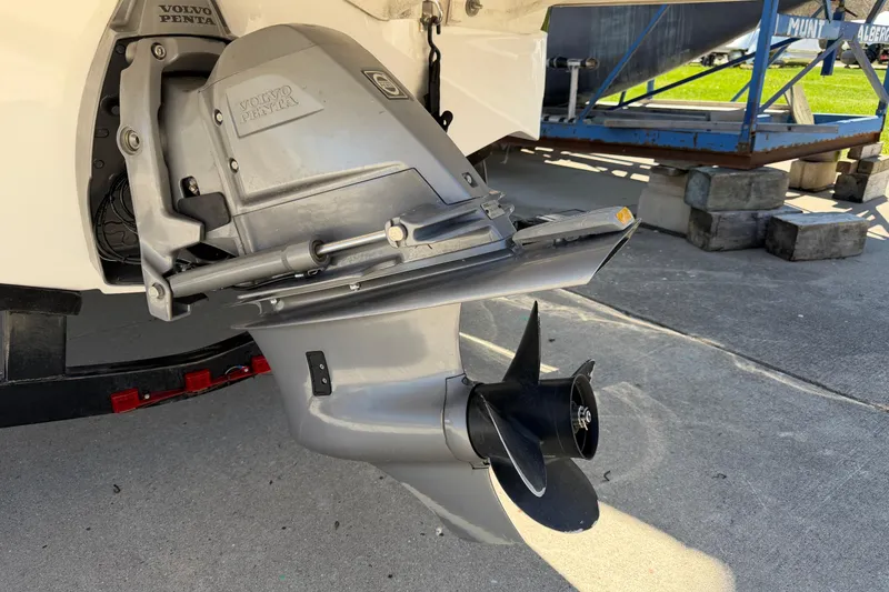 Slide: The Image of 2013 Regal 1900 Bowrider with Volvo Penta outboard motor, docked on concrete surface. - 28