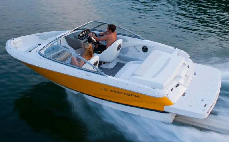 Slide: The Image of Manufacturer Provided Image: 2013 Regal 1900 Bowrider boat cruising on water. - 31