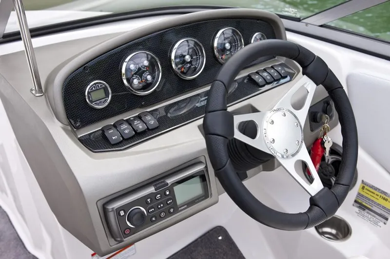 Slide: The Image of Manufacturer Provided Image: 2013 Regal 1900 Bowrider dashboard with steering wheel and control panel. - 34