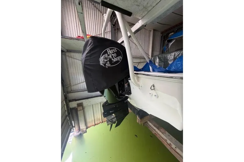 Slide: The Image of 2022 Boston Whaler 170 Montauk boat interior with steering console and seating. - 2