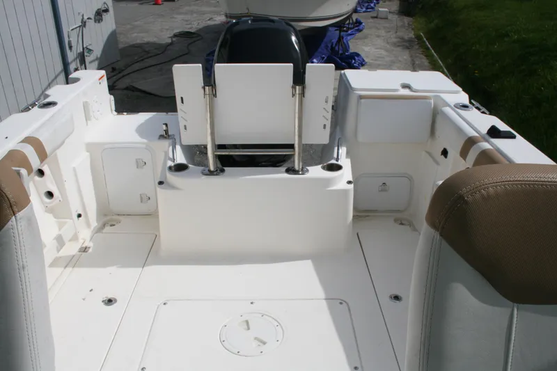 Slide: The Image of 2014 Seaswirl Striper 220 WA boat interior with seating and storage compartments. - 10