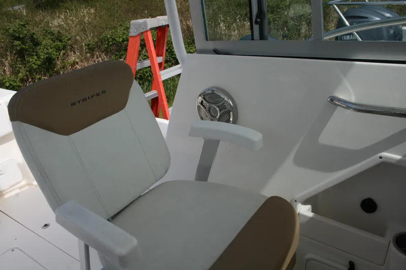 Slide: The Image of 2014 Seaswirl Striper 220 WA boat interior with seat and speaker detail. - 12