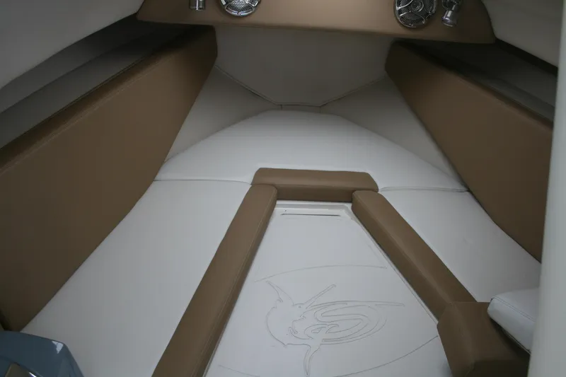 Slide: The Image of 2014 Seaswirl Striper 220 WA cabin interior with beige and white upholstery. - 13