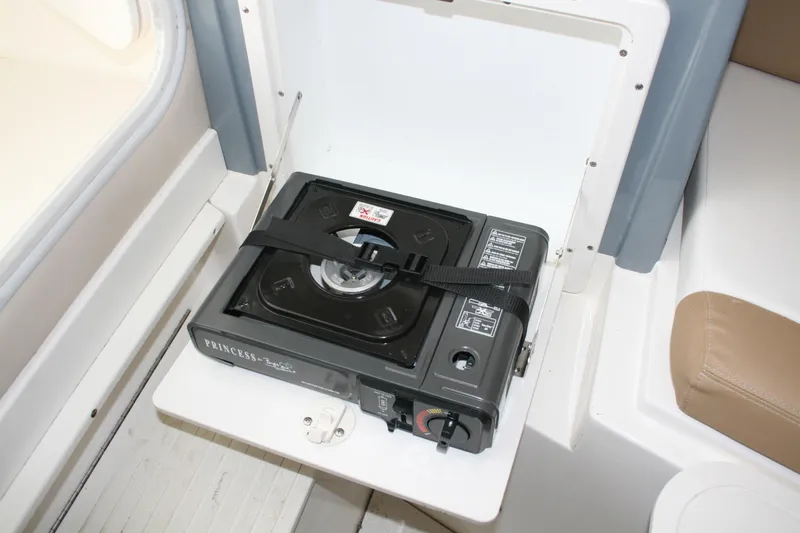 Slide: The Image of Portable stove on 2014 Seaswirl Striper 220 WA boat, secured with a strap. - 17