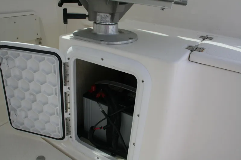 Slide: The Image of Open storage compartment on 2014 Seaswirl Striper 220 WA boat, revealing battery inside. - 22