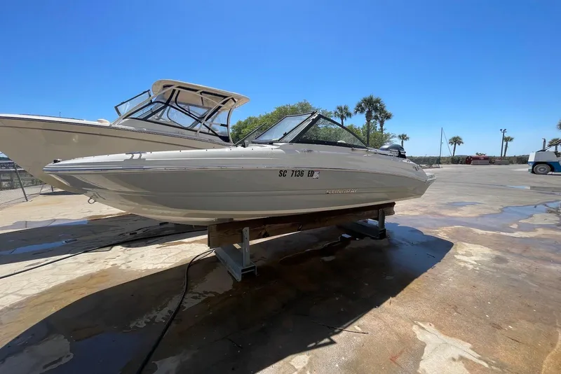The Image of 2023 Stingray 191 DC boat on display under clear blue sky. - 0
