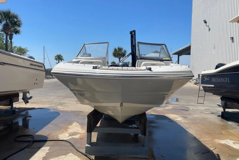 Slide: The Image of 2023 Stingray 191 DC boat on display outdoors, surrounded by other boats. - 3