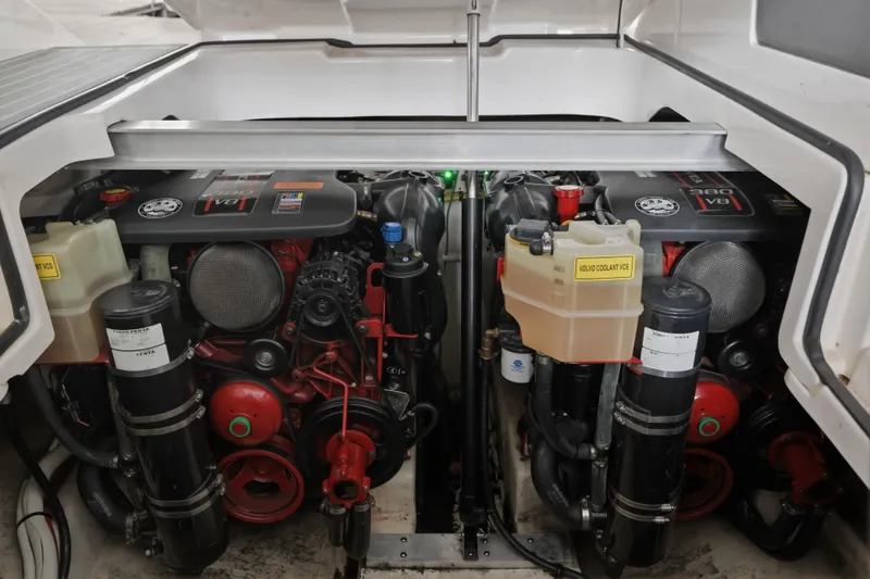 Slide: The Image of Engine compartment of a 2014 Chaparral 327 SSX boat, featuring dual Volvo V8 engines. - 38