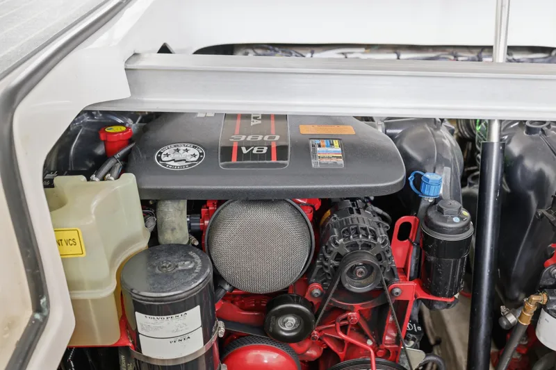 Slide: The Image of Engine compartment of a 2014 Chaparral 327 SSX boat, featuring a V8 380 engine. - 39