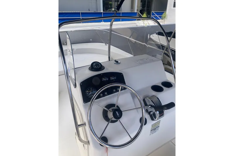 Slide: The Image of 2007 Boston Whaler 190 Montauk boat console with steering wheel and gauges. - 10