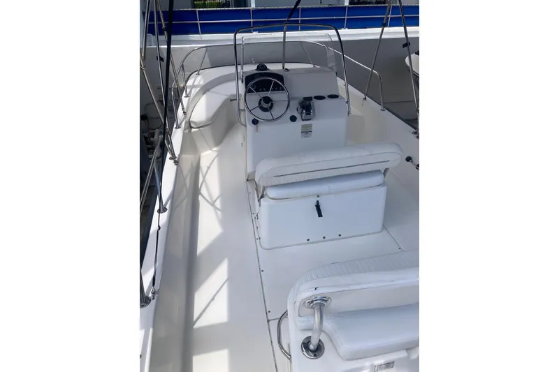Slide: The Image of 2007 Boston Whaler 190 Montauk boat interior with steering console and seating. - 16