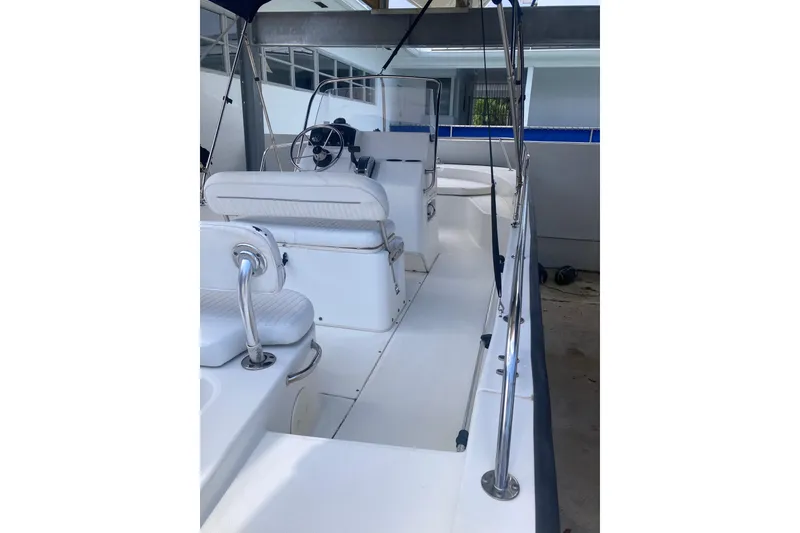 Slide: The Image of 2007 Boston Whaler 190 Montauk boat interior with seating and steering console. - 18