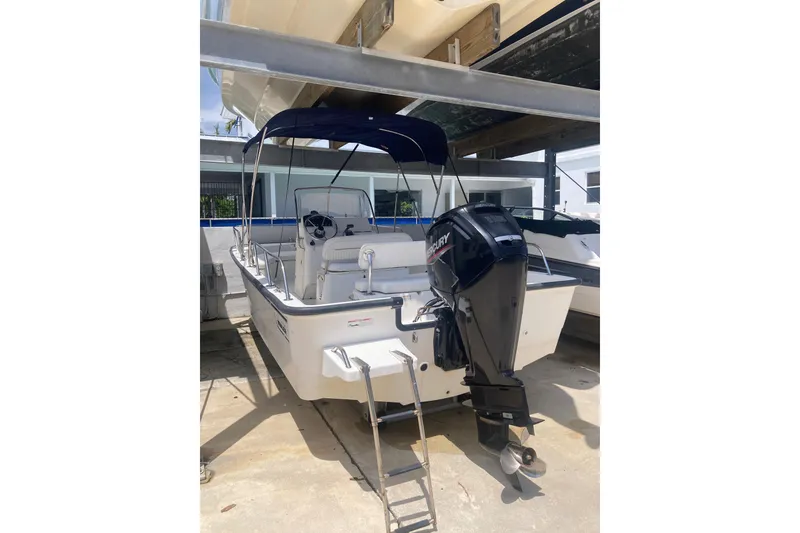 Slide: The Image of 2007 Boston Whaler 190 Montauk boat with Mercury engine in storage. - 22