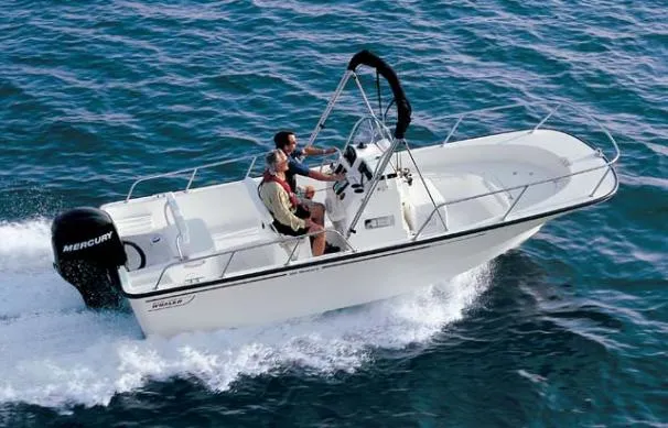 Slide: The Image of 2007 Boston Whaler 190 Montauk boat on lift with Mercury engine. - 23