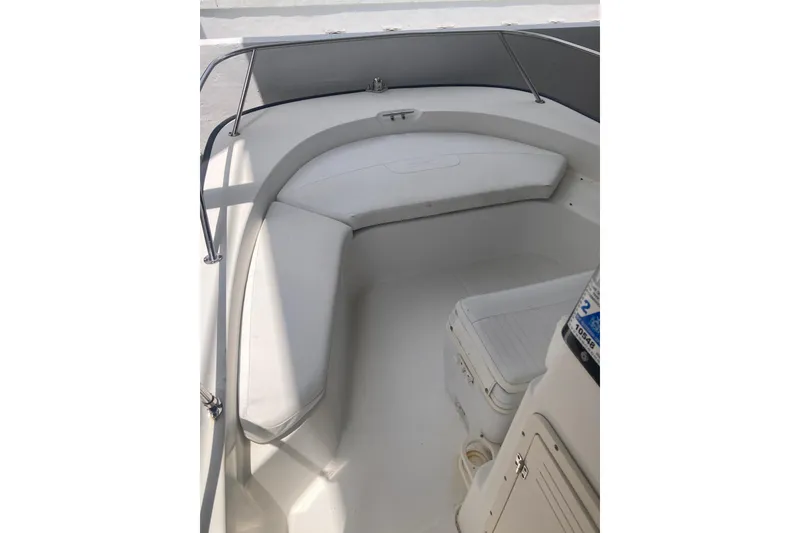 Slide: The Image of 2007 Boston Whaler 190 Montauk boat interior with cushioned seating and storage. - 4