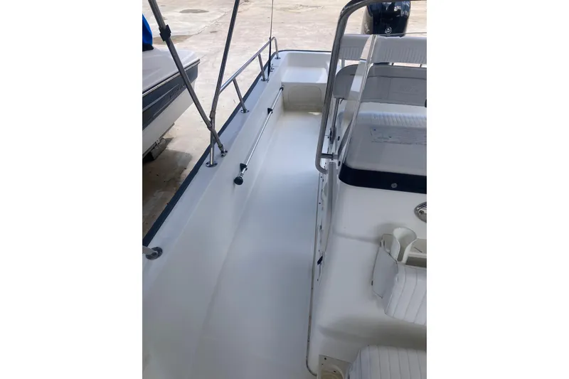 Slide: The Image of 2007 Boston Whaler 190 Montauk boat interior with seating and railing. - 8
