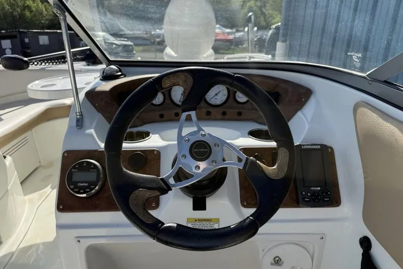 Slide: The Image of 2014 SouthWind 212sd boat dashboard with steering wheel and navigation instruments. - 11
