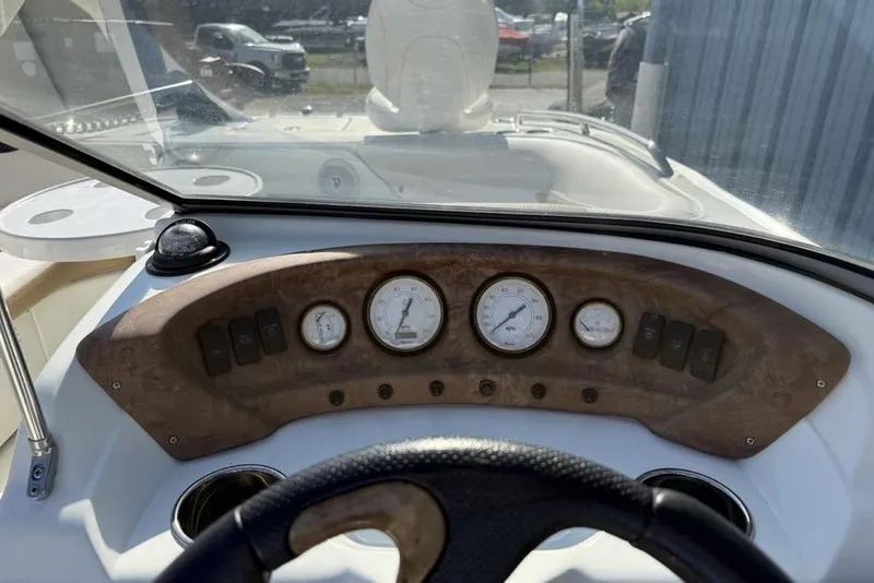 Slide: The Image of Dashboard of a 2014 SouthWind 212sd boat with gauges and controls. - 14