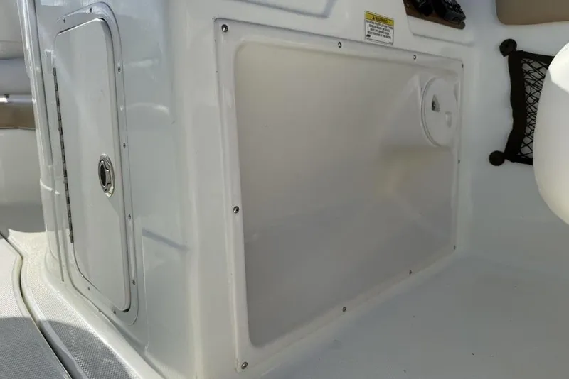 Slide: The Image of 2014 SouthWind 212sd boat interior storage compartment and panel detail. - 20