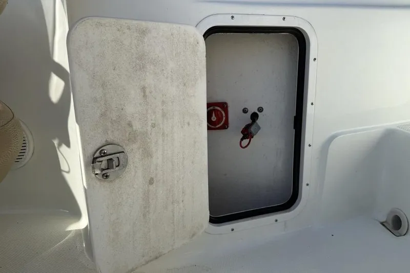 Slide: The Image of Open storage compartment on a 2014 SouthWind 212sd boat. - 27