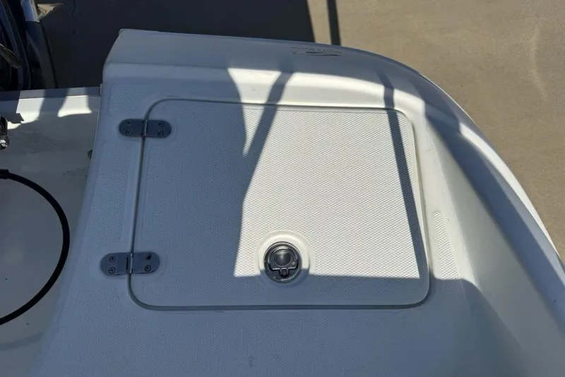Slide: The Image of 2014 SouthWind 212sd boat hatch with textured surface and metal latch. - 41